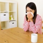 Asian woman with nose allergy