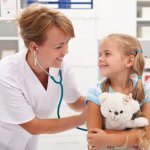 Little girl at the doctor for a checkup examination